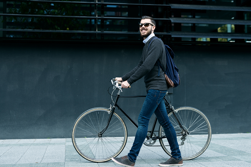 man with bike and backpack