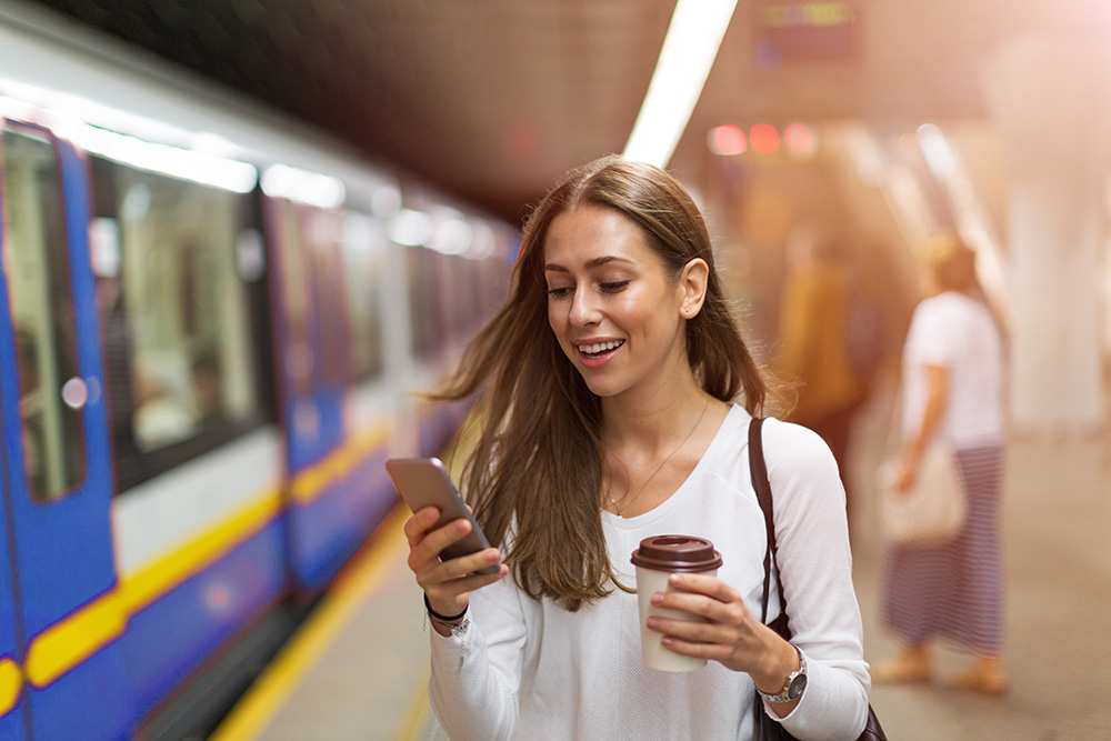 woman commute by train using phone app