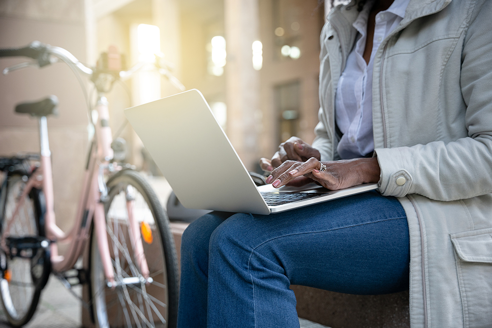 woman with bike and laptop